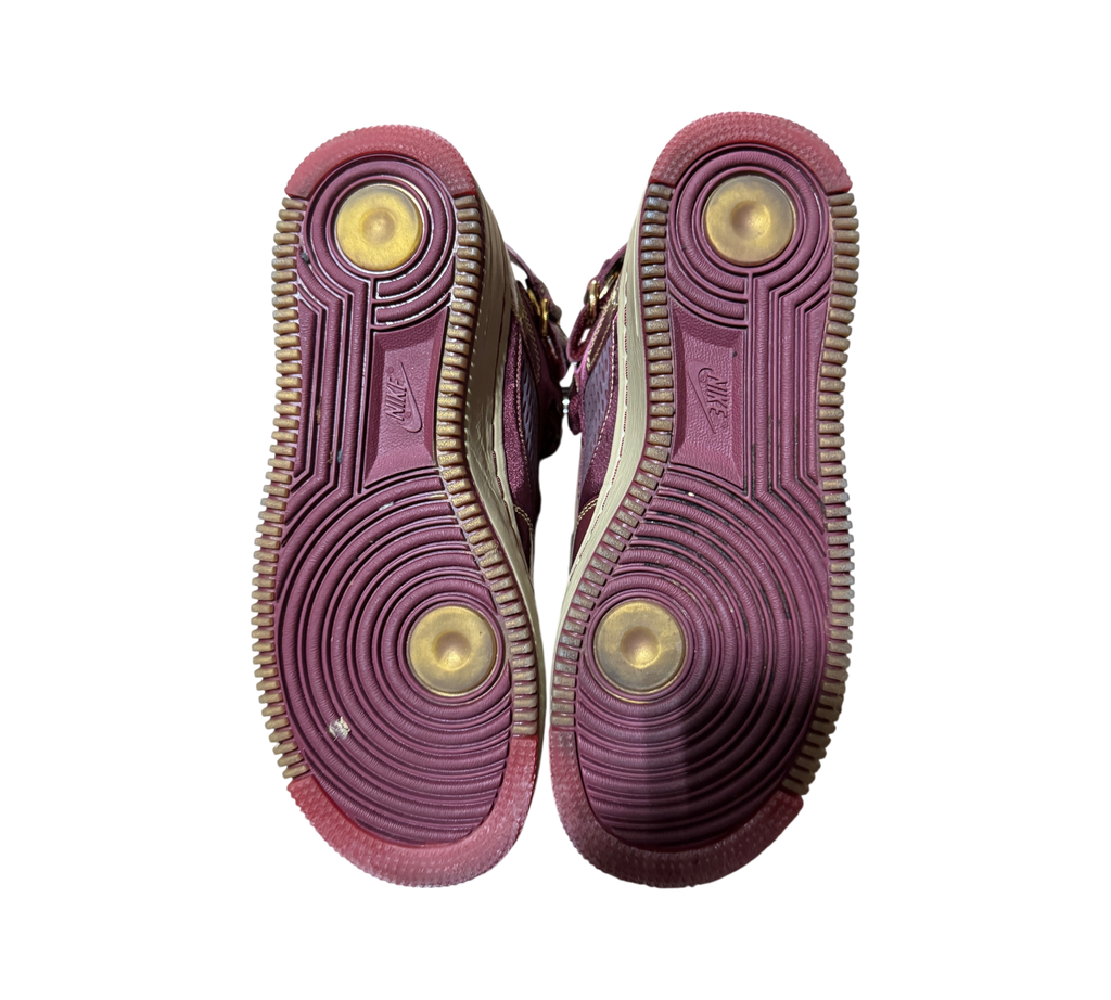 Genesis Boutique Jordan 5 Fusion Wine and Grind sneakers showing the maroon rubber outsoles with circular tread pattern
