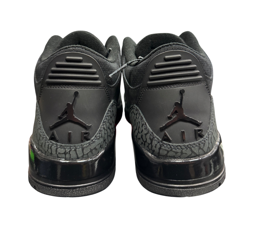 Genesis Boutique used Jordan 3 Black Cat sneakers showing the black heel tabs with Jumpman Air branding
