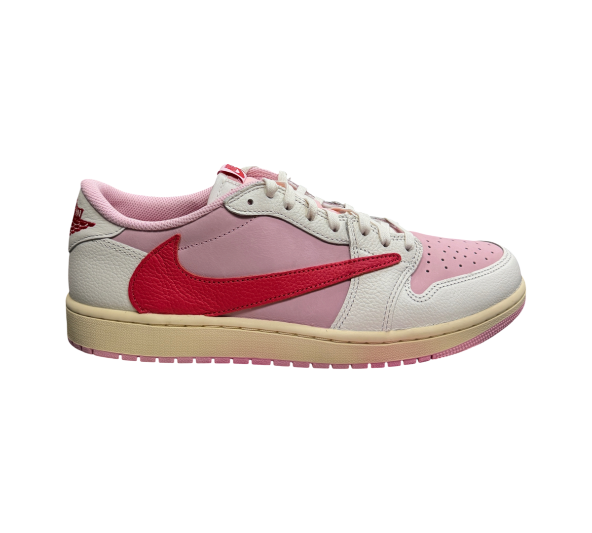 Genesis Boutique Jordan 1 Low Travis Scott Tropical Pink sneaker with a reverse red swoosh and cream midsole
