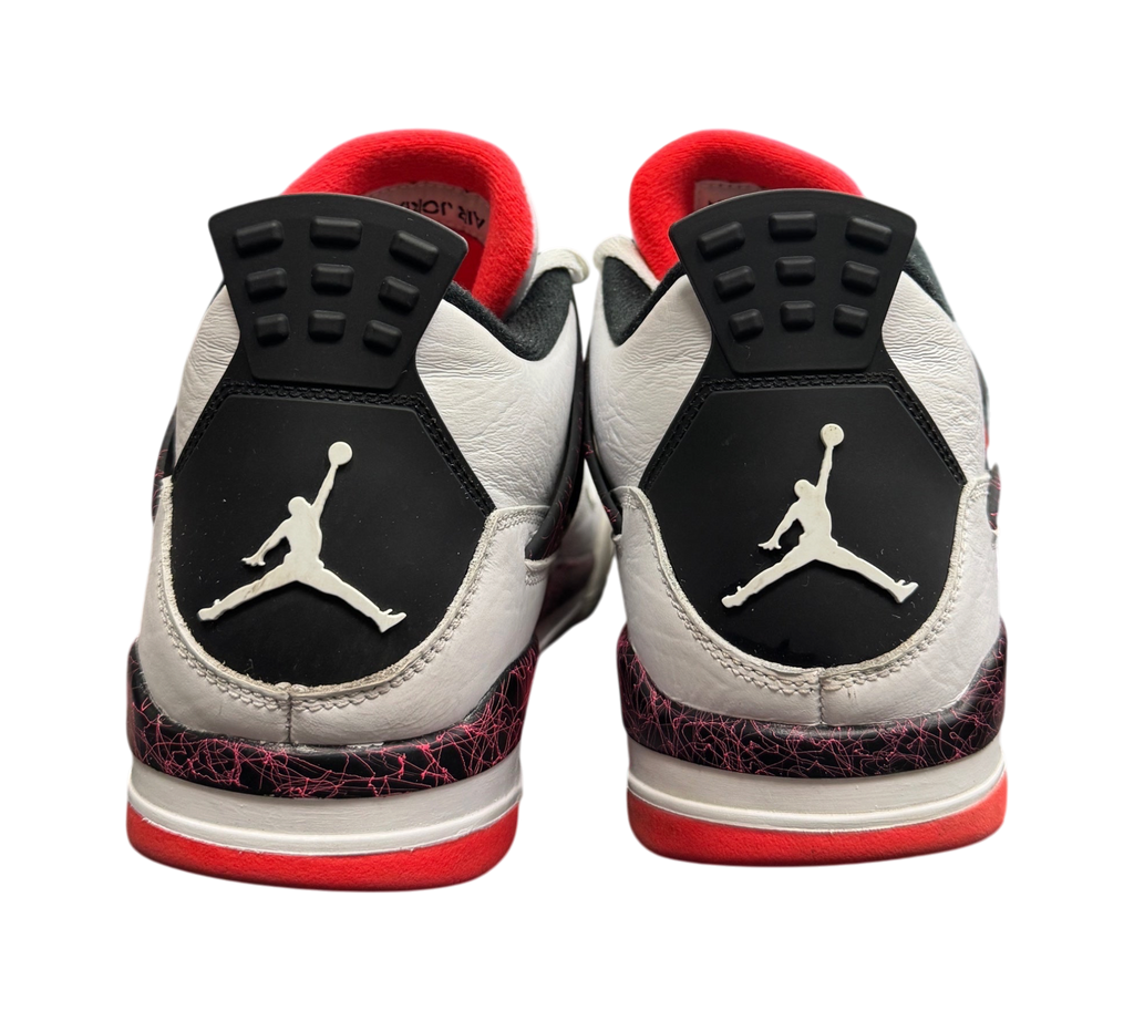 Genesis Boutique Jordan 4 Pale Citron sneakers showing the white leather heels with black and red patterned accents