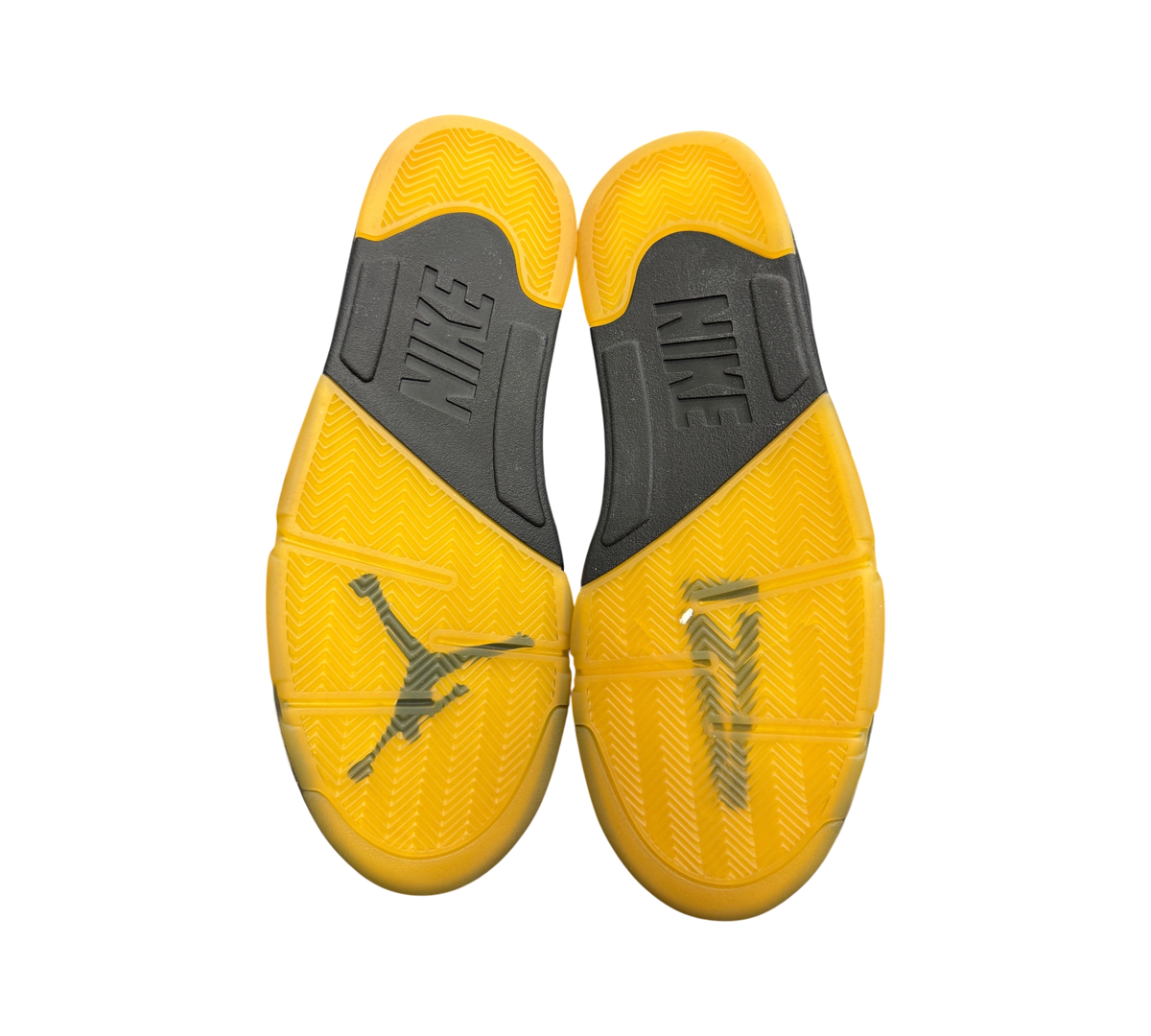 Genesis Boutique Jordan 5 A Ma Maniere Dawn sneakers showing the yellow translucent rubber outsoles and black midsoles