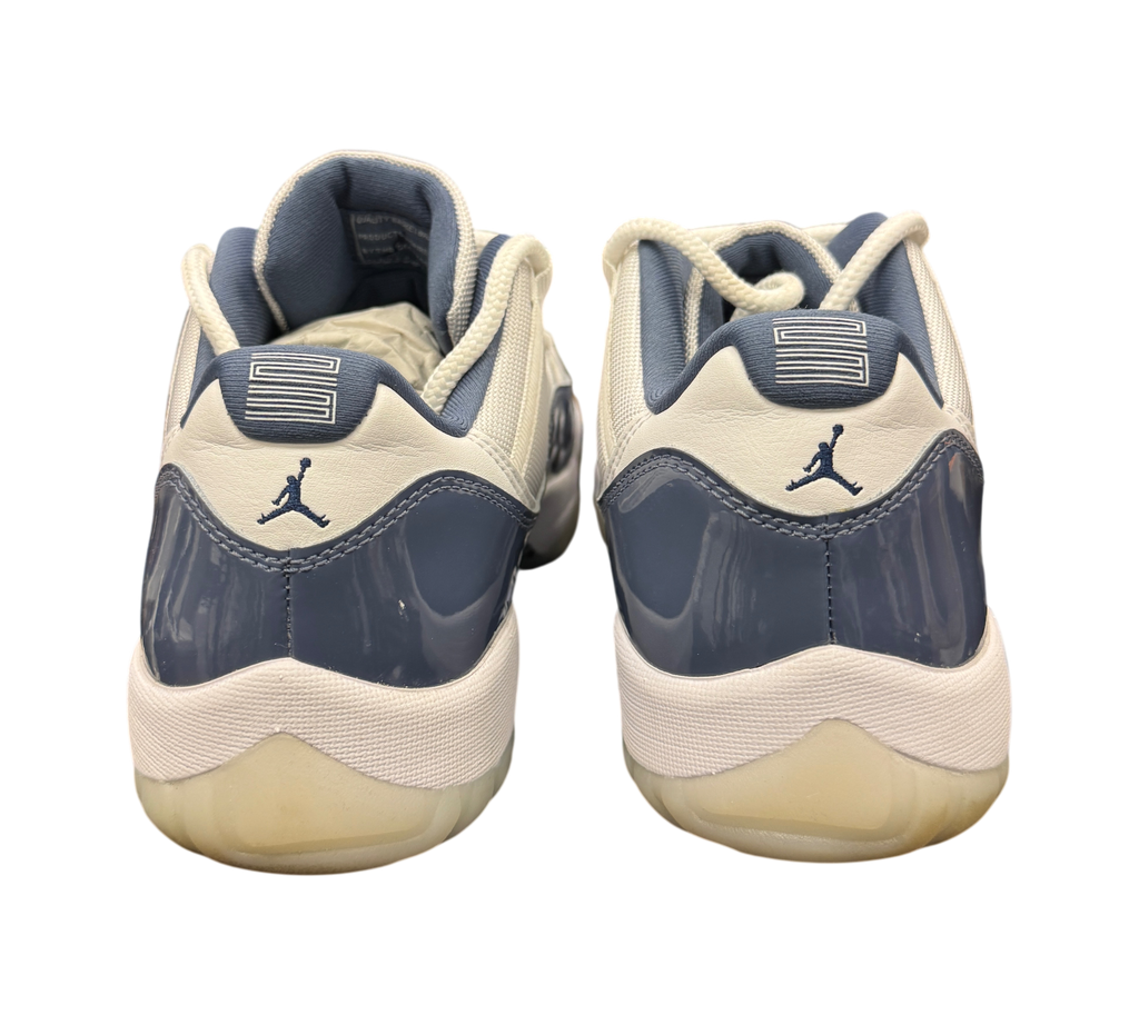 Genesis Boutique Air Jordan 11 Low Diffused Blue sneakers, rear view showing patent leather and Jumpman logo detail.