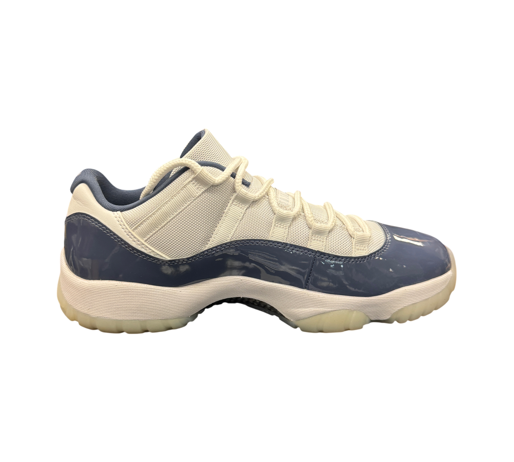 Genesis Boutique Air Jordan 11 Low Diffused Blue sneaker with white mesh upper and glossy blue patent leather mudguard