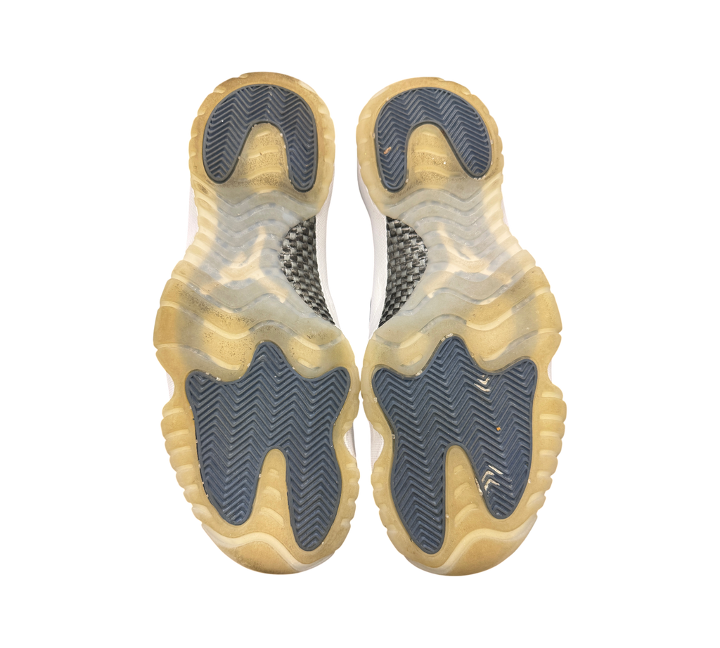 Genesis Boutique Air Jordan 11 Low Diffused Blue sneakers showing the translucent rubber outsoles and carbon fiber plate