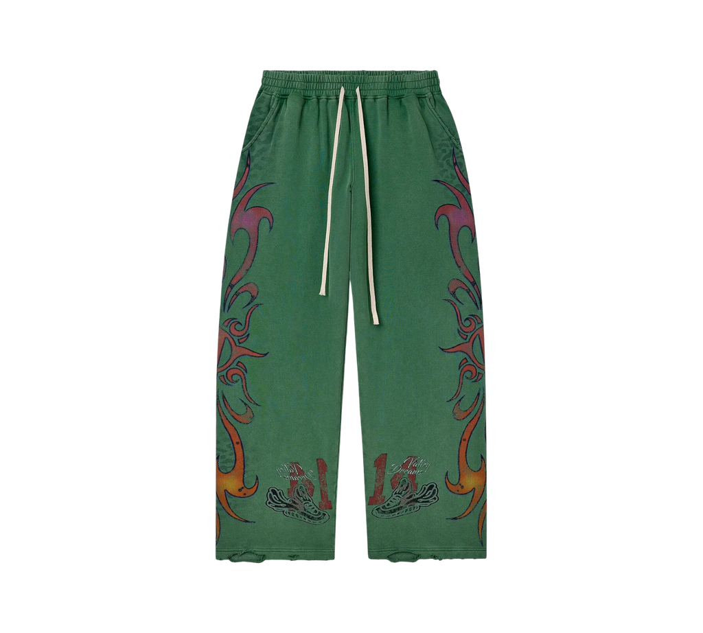 Genesis Boutique Vale Inferno wide-fit green sweatpants with flame-inspired graphic prints and drawstring waist