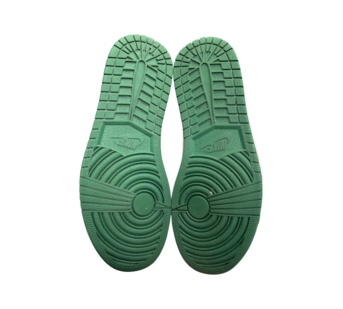 Genesis Boutique Jordan 1 Gorge Green sneakers showing the green rubber outsoles with circular traction patterns