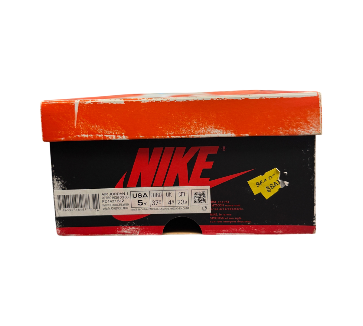 Genesis Boutique Jordan 1 GS Lost and Found sneaker box with red and black branding on a glass display counter