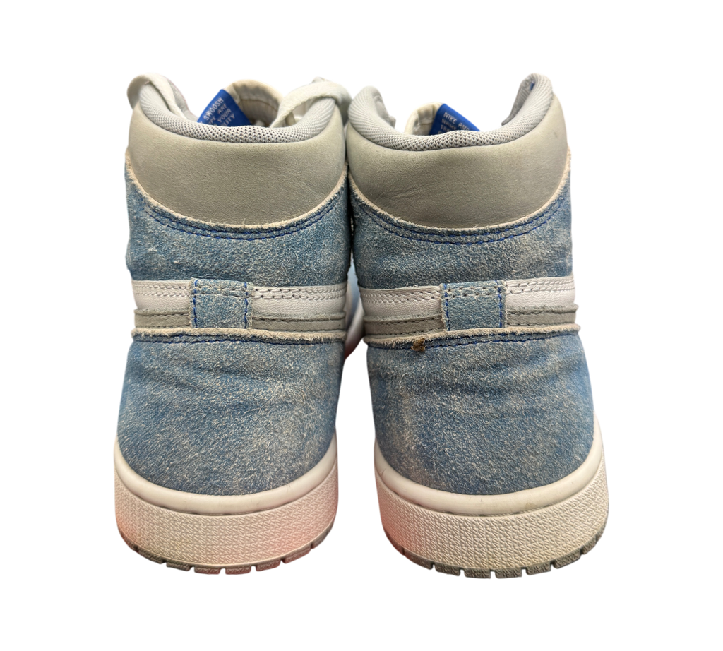 Genesis Boutique Jordan 1 GS Hyper Royal sneakers showing the blue suede heel and white midsole from the back view