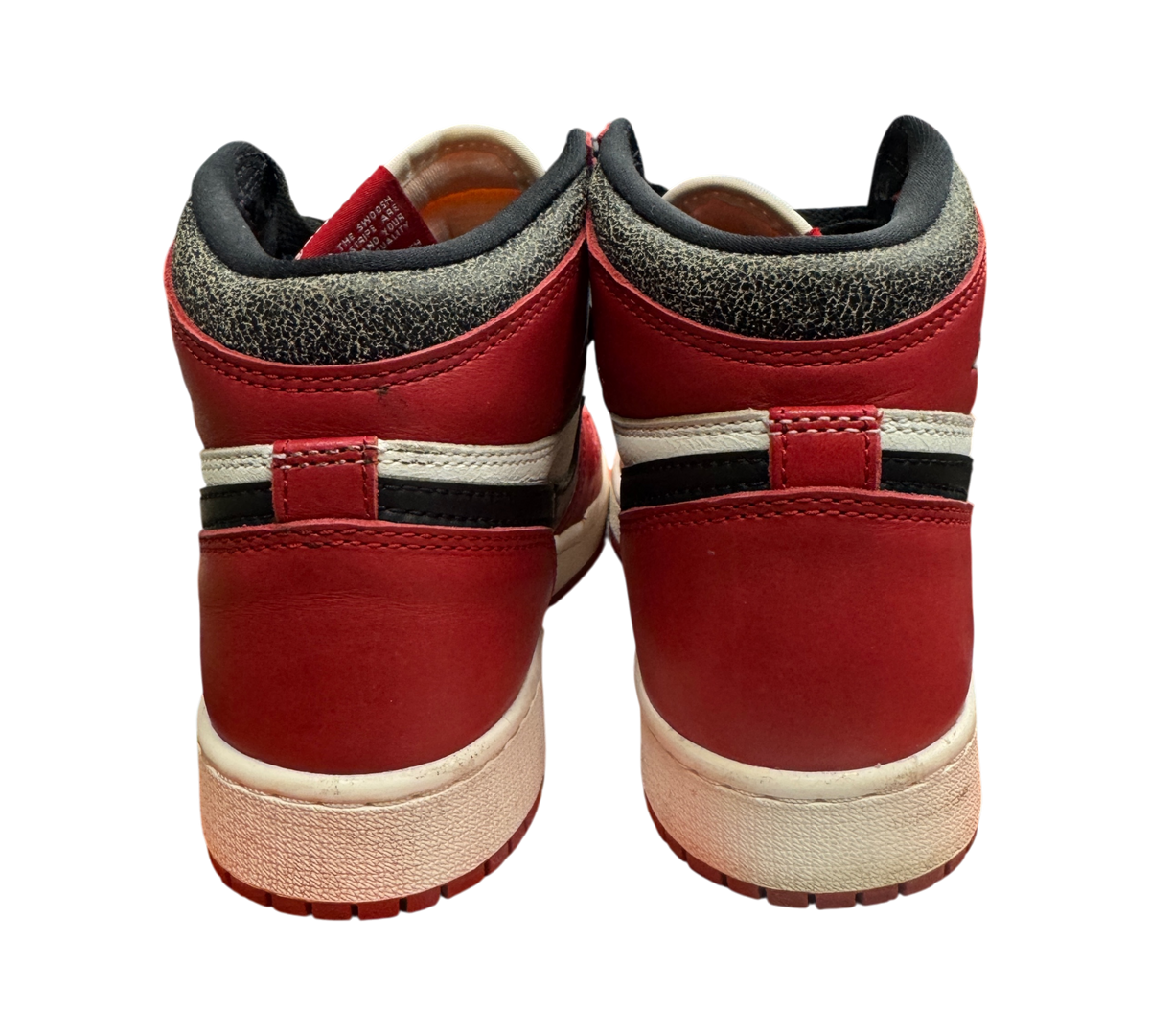 Genesis Boutique Jordan 1 GS Lost and Found high-top sneakers in red, white, and black, rear view on shoebox
