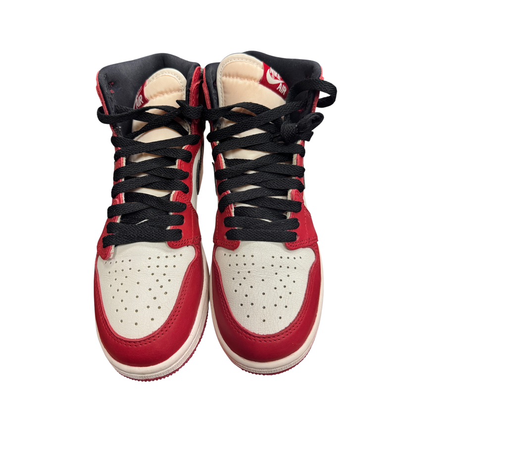 Genesis Boutique Jordan 1 GS Lost and Found sneakers in red, white, and black with black laces on an orange box