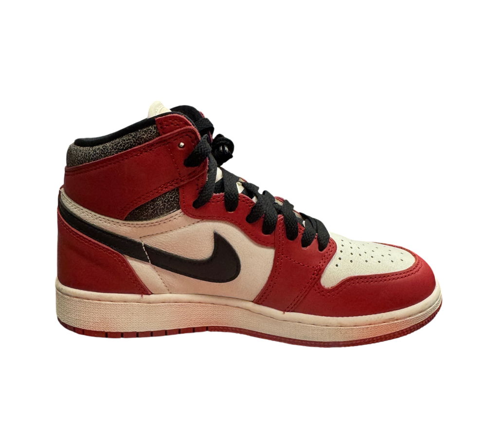Genesis Boutique Jordan 1 GS Lost and Found sneaker in red, white, and black leather on a Nike shoebox