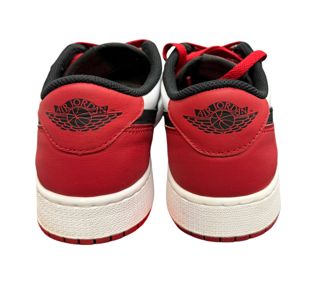 Genesis Boutique Jordan 1 Low Black Toe sneakers showing the red leather heel and black Air Jordan wings logo