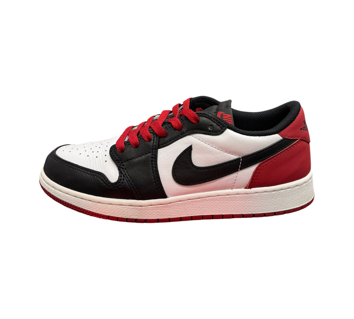 Genesis Boutique Jordan 1 Low Black Toe sneakers featuring white leather, black overlays, and red accents.
