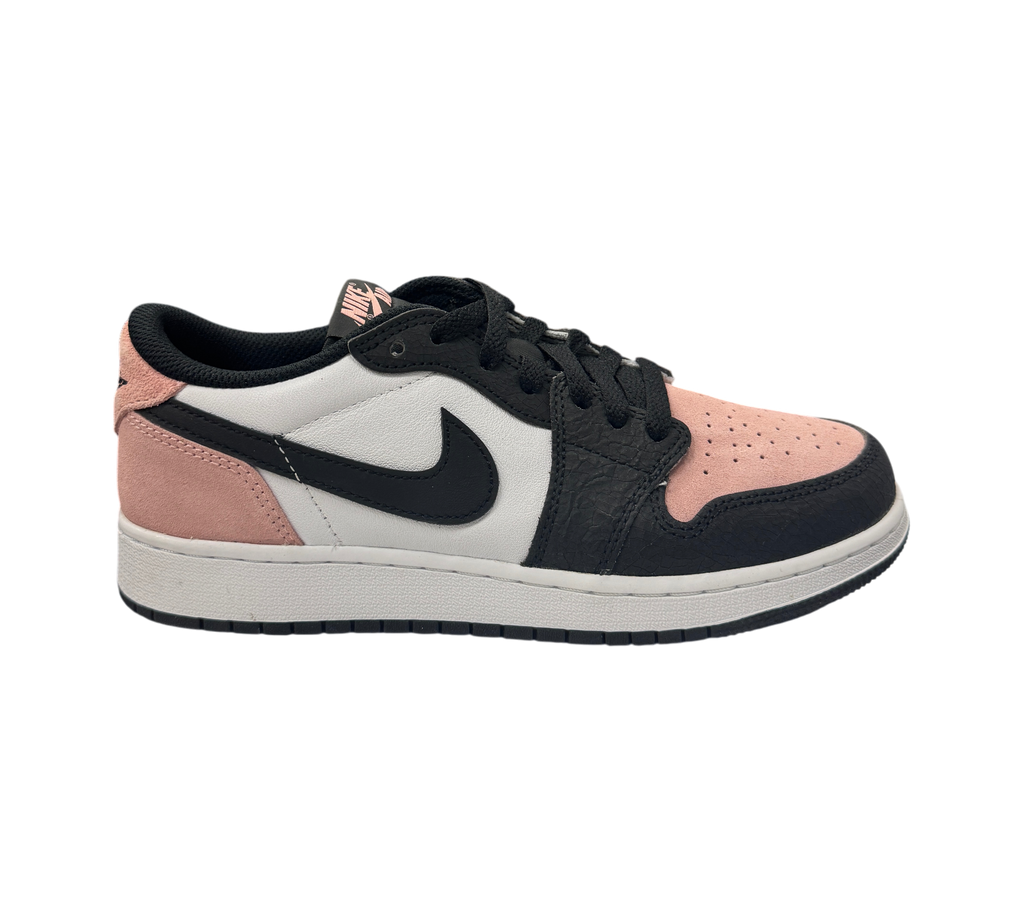 Genesis Boutique Jordan 1 Low GS Bleached Coral sneakers featuring pink suede, white leather, and black overlays.
