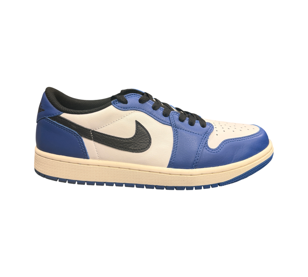 Genesis Boutique Jordan 1 Low Game Royal sneakers with white leather and royal blue overlays, black swoosh, and cream sole.