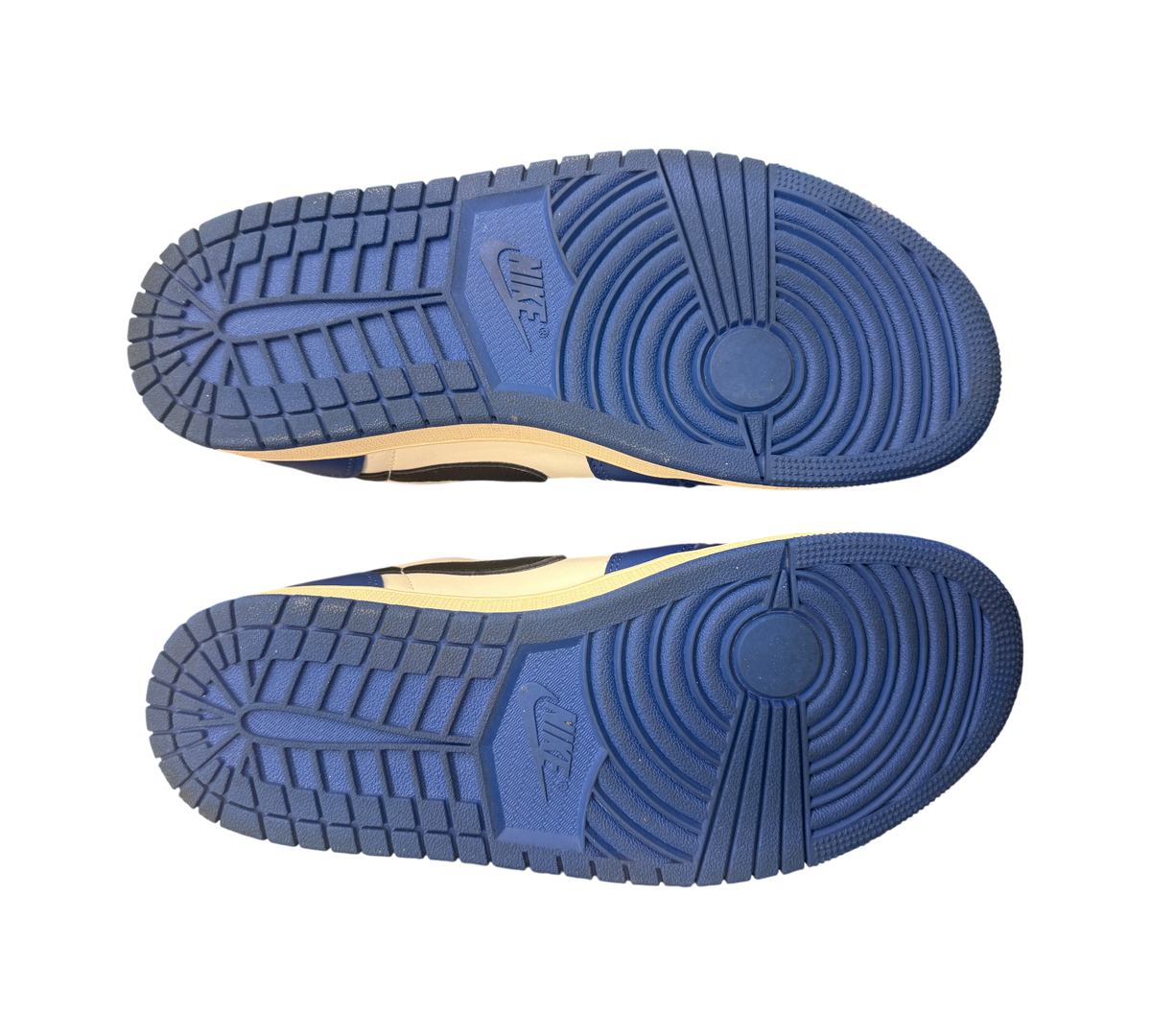 Genesis Boutique Jordan 1 Low Game Royal CZ0790-140 soles. Blue rubber soles with Nike branding and tread pattern.