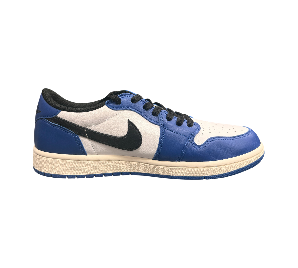 Genesis Boutique Jordan 1 Low Game Royal sneakers with white leather and royal blue overlays, black swoosh and laces.