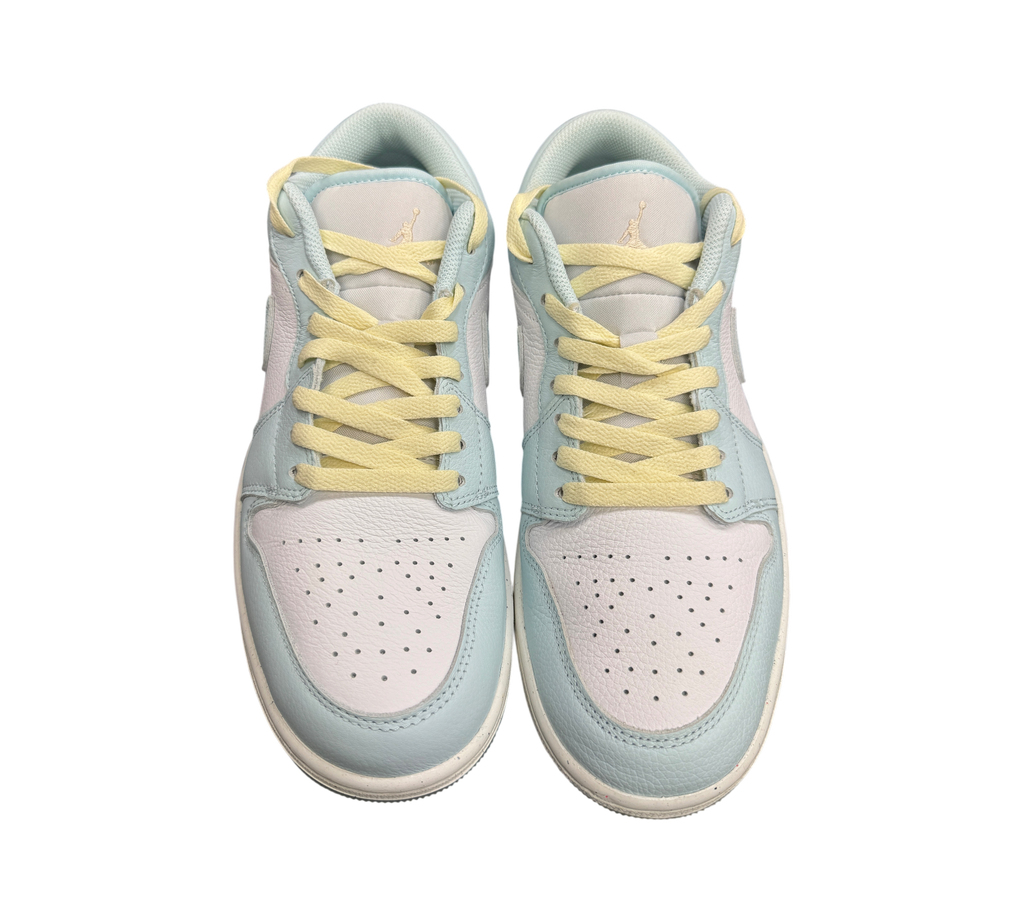 Genesis Boutique Jordan 1 Low Glacier Summit White sneakers featuring pastel blue leather and pale yellow laces.