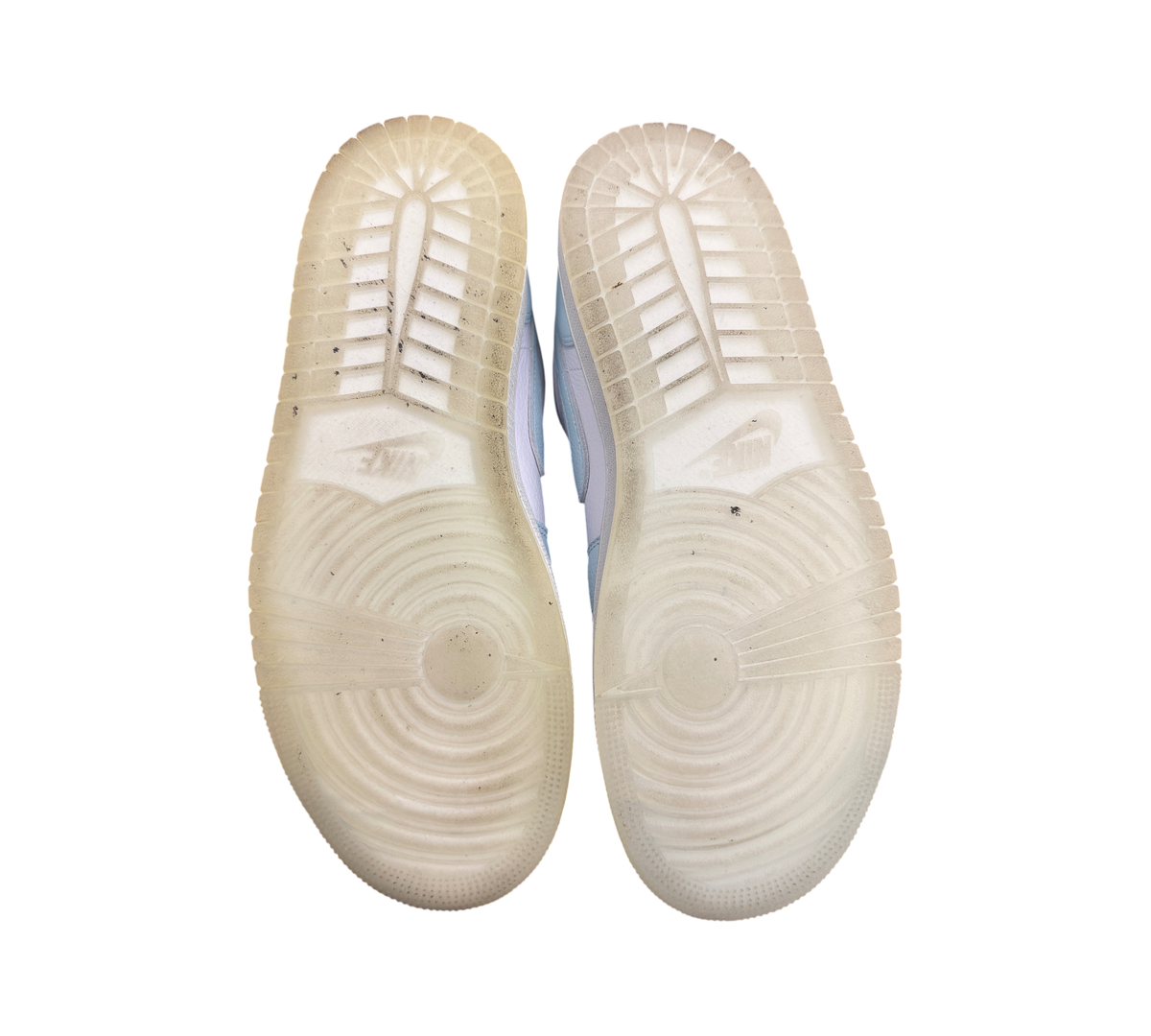 Genesis Boutique used Jordan 1 Low Glacier Summit White sneakers showing translucent rubber outsoles with tread