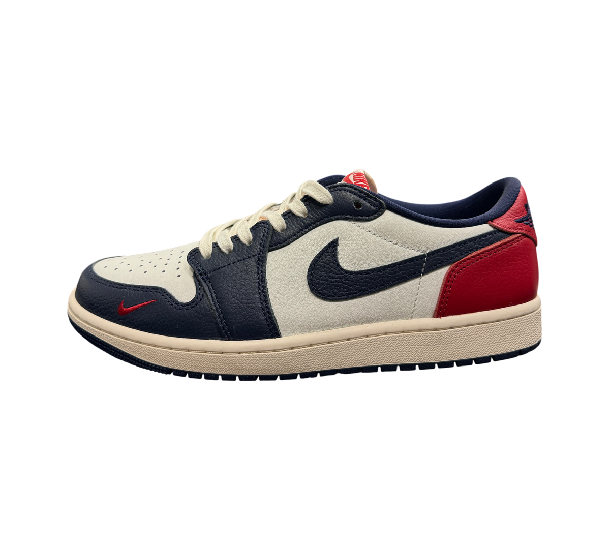 Genesis Boutique Jordan 1 Low Howard Uni sneaker in white, navy blue, and red leather with a vintage cream midsole.