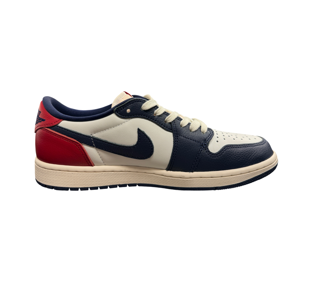 Genesis Boutique Jordan 1 Low Howard Uni sneakers in white, navy, and red leather with a side profile view.