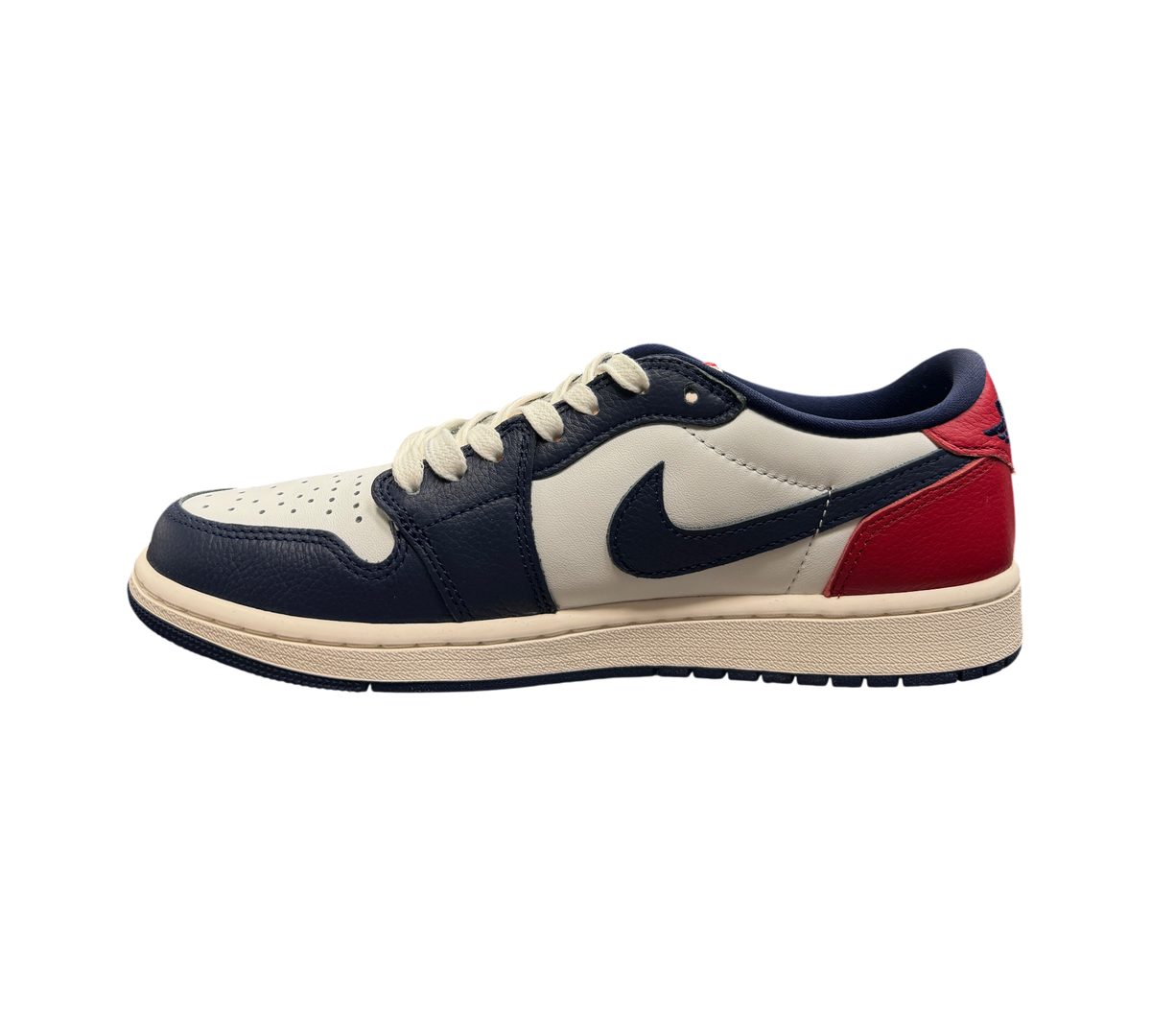 Genesis Boutique Jordan 1 Low Howard Uni sneaker in white, navy blue, and red leather with a side profile view.