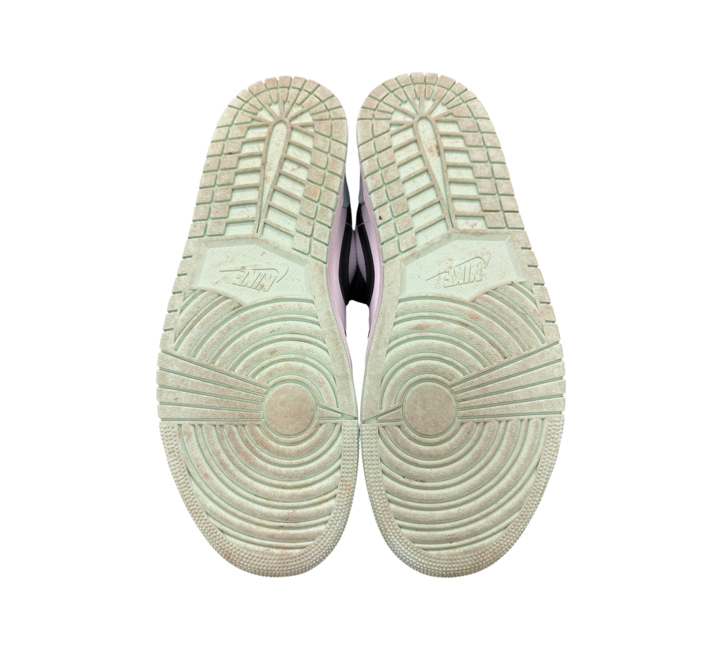 Genesis Boutique used Jordan 1 Low Mint Foam sneakers showing the light green rubber outsoles with tread patterns.