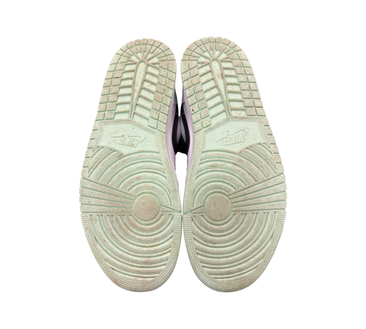 Genesis Boutique used Jordan 1 Low Mint Foam sneakers showing the light green rubber outsoles with tread patterns.