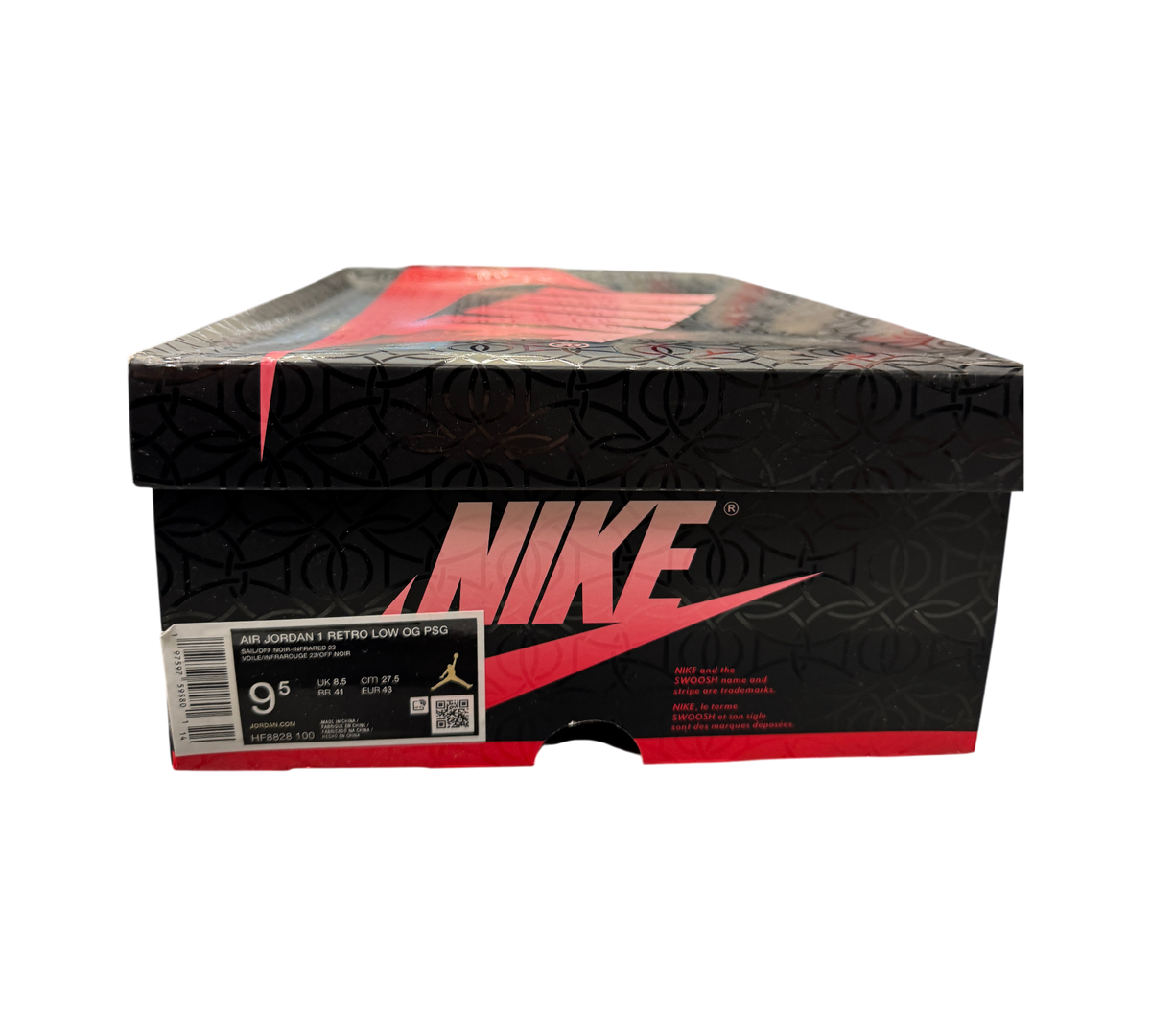 Genesis Boutique Jordan 1 Low PSG sneaker box with black and red branding in a retail store setting.