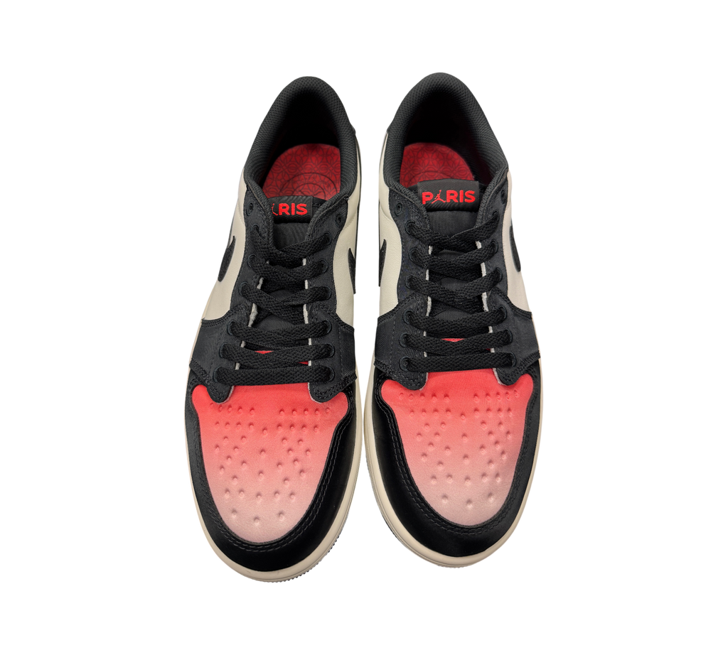 Genesis Boutique Jordan 1 Low PSG sneakers featuring a black, white, and red gradient toe box with Paris branding.