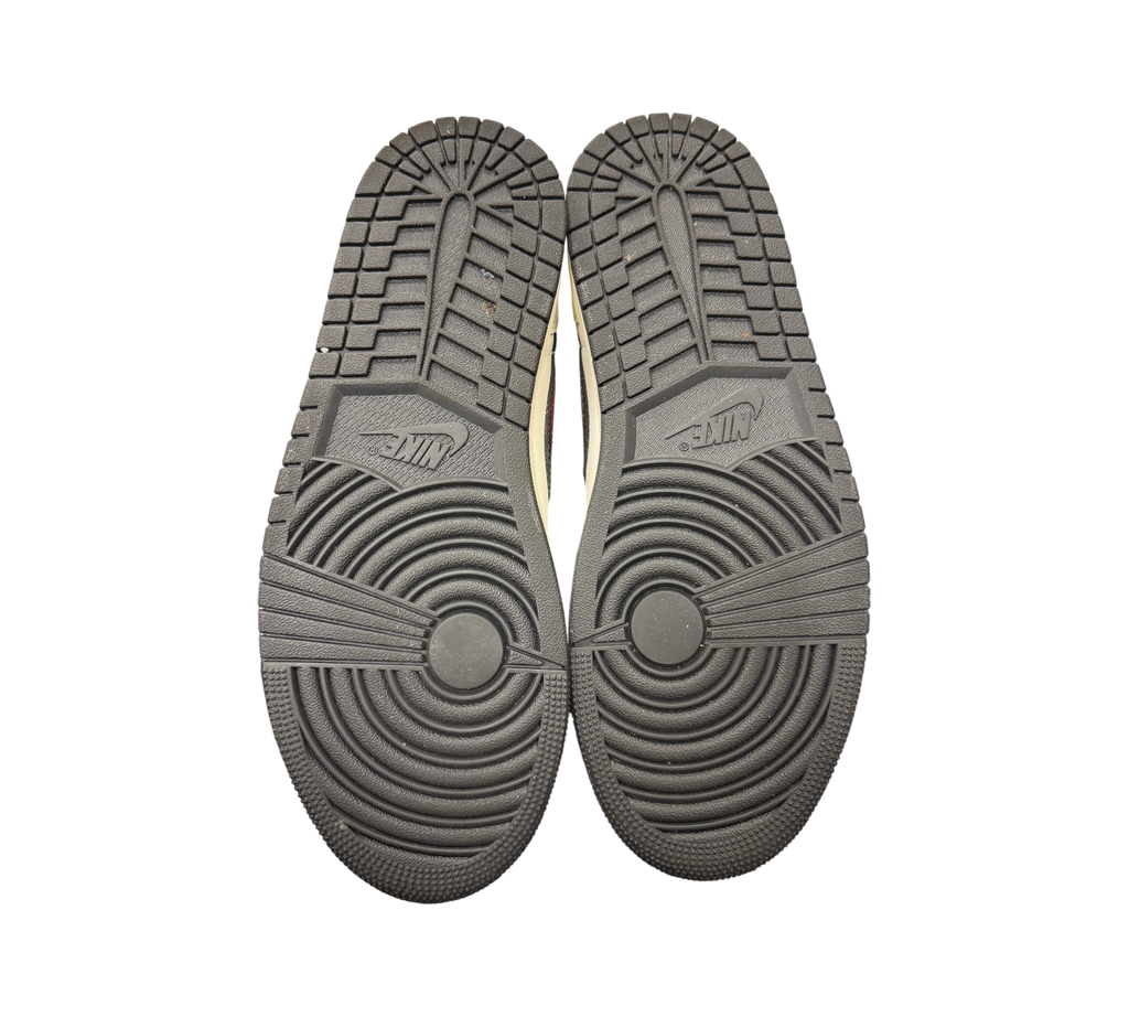 Genesis Boutique Jordan 1 Low PSG sneaker outsoles showing black rubber tread pattern and Nike branding