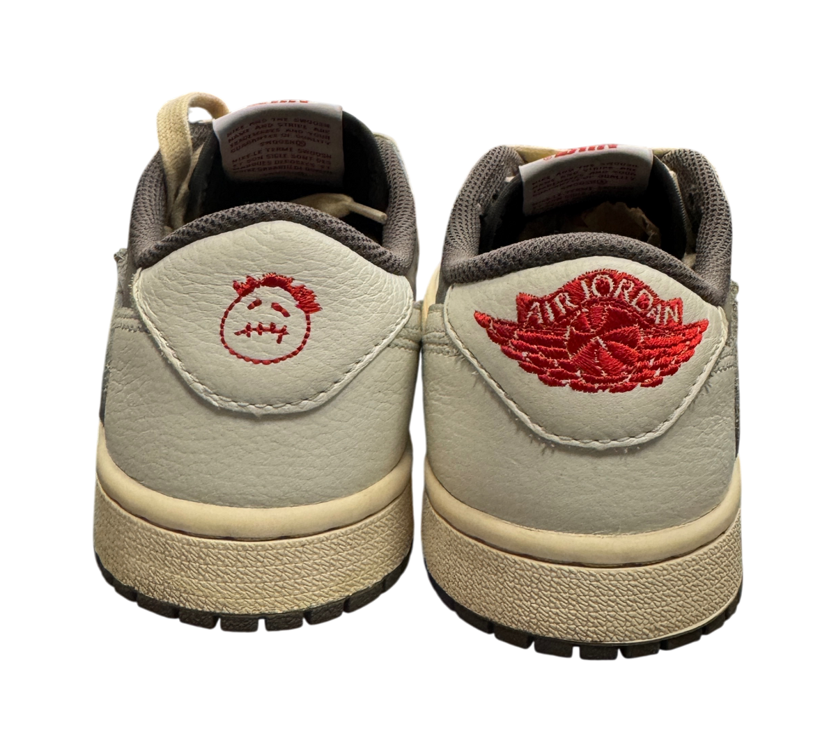Genesis Boutique pre-owned Jordan 1 Low Travis Scott Reverse Mocha sneakers showing heel embroidery and branding