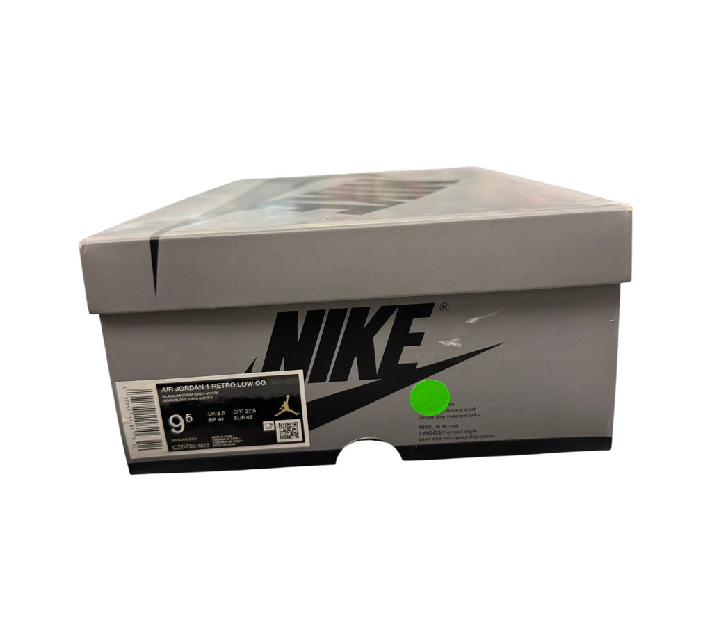 Genesis Boutique Jordan 1 Low Shadow sneaker box with size 9.5 label and Nike branding on a black background