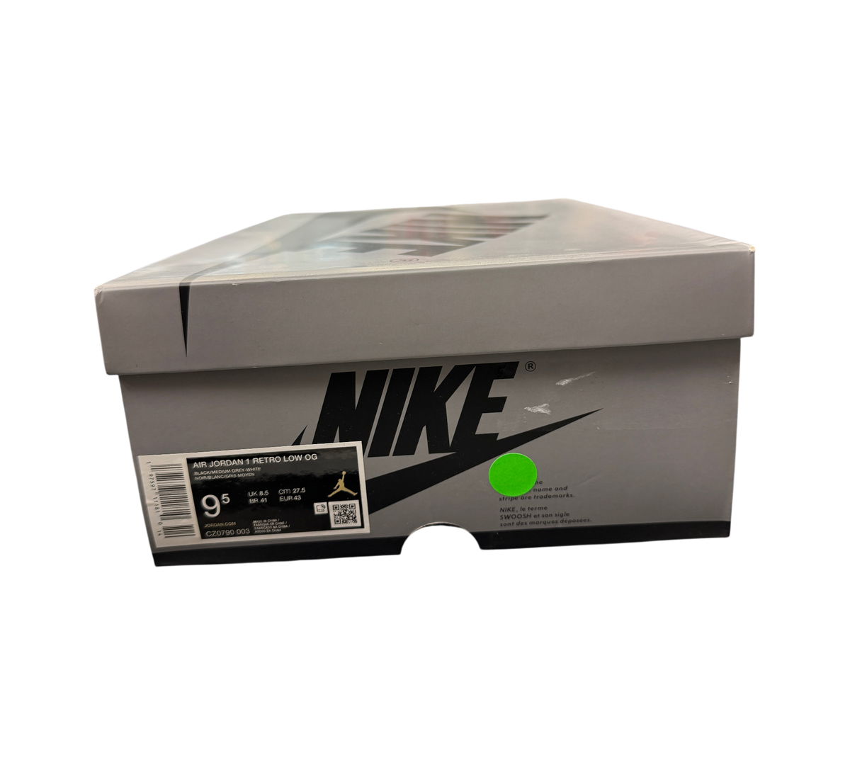Genesis Boutique Jordan 1 Low Shadow sneaker box with size 9.5 label and Nike branding on a black background