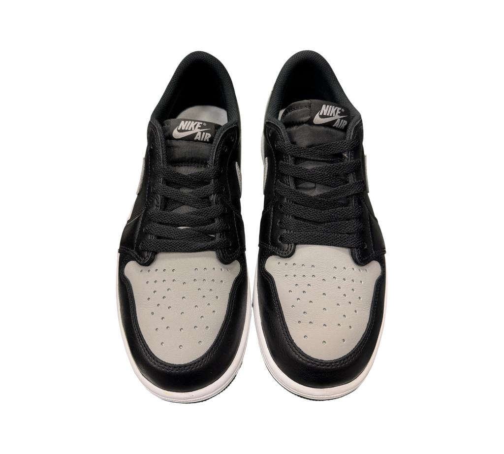 Genesis Boutique pre-owned Jordan 1 Low Shadow sneakers in black and grey leather with Nike Air tongue branding.