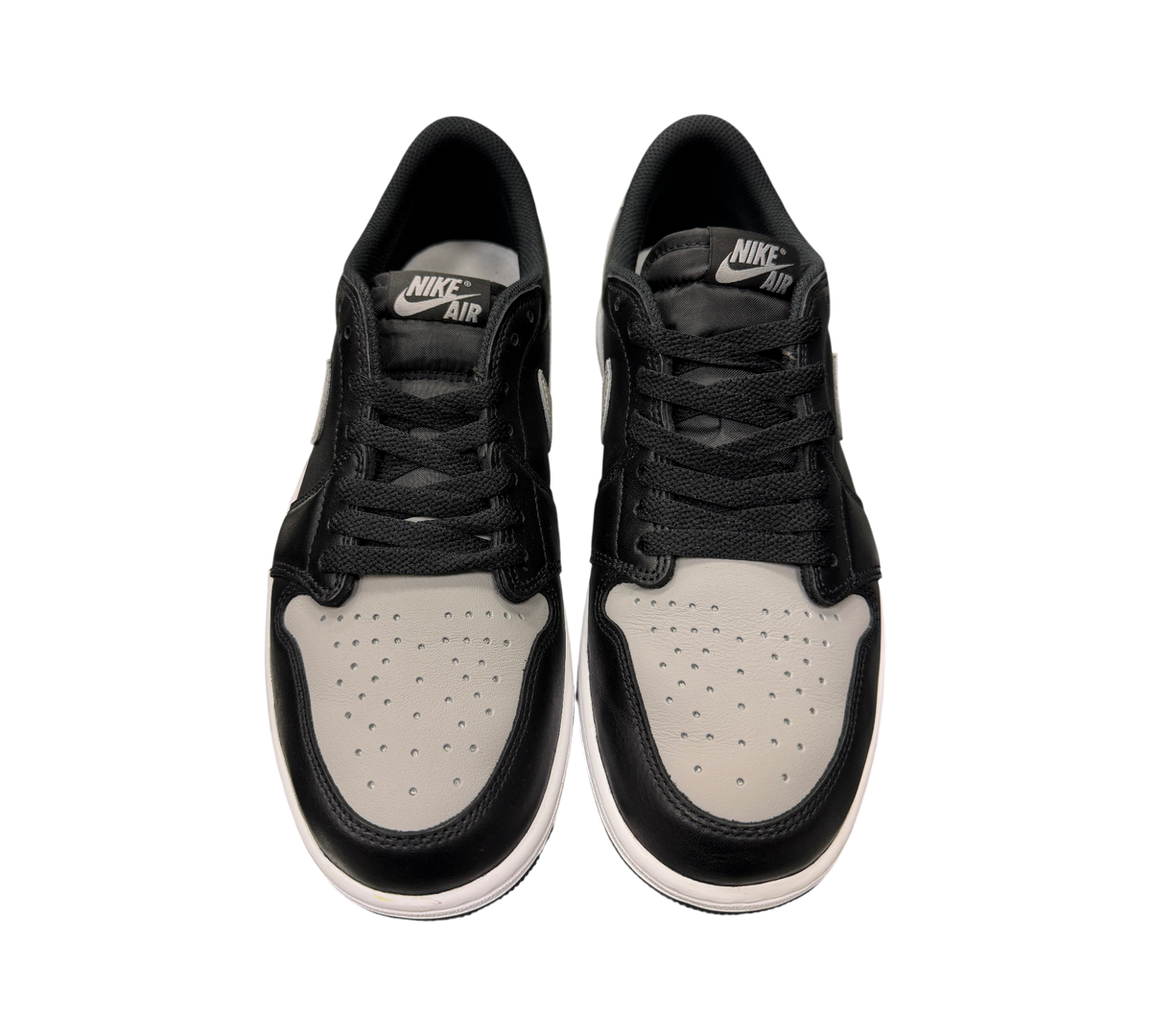 Genesis Boutique pre-owned Jordan 1 Low Shadow sneakers in black and grey leather with Nike Air tongue branding.