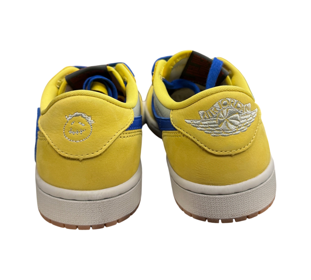 Genesis Boutique Jordan 1 Low Travis Scott Canary sneakers showing yellow suede heels with Cactus Jack embroidery