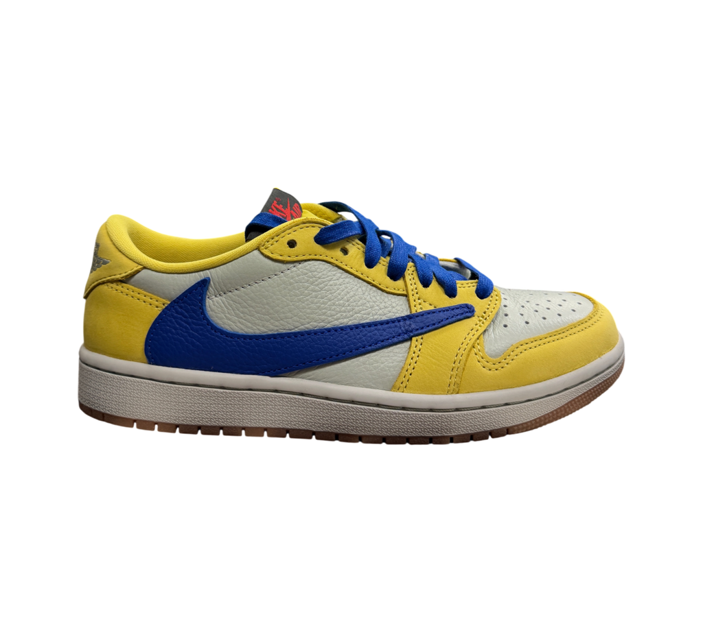Genesis Boutique Jordan 1 Low Travis Scott Canary sneakers in yellow, white, and blue leather on a shoebox