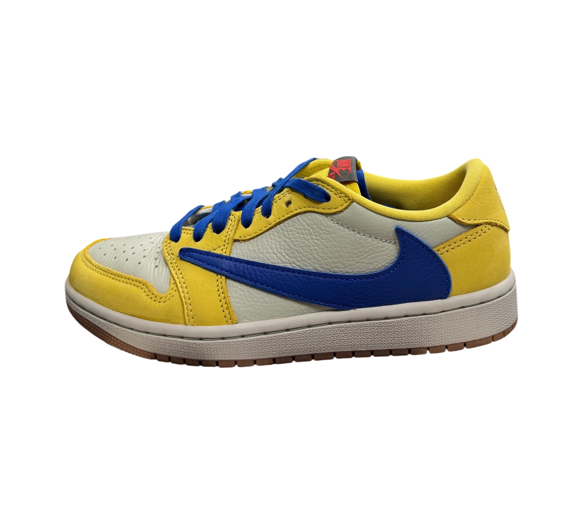 Genesis Boutique Jordan 1 Low Travis Scott Canary sneaker in yellow, grey, and blue leather on a branded box