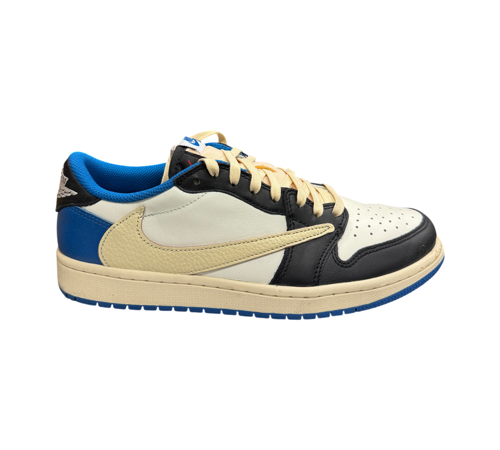 Genesis Boutique Jordan 1 Low Travis Scott Fragment sneaker in white, black, and royal blue with a cream reverse swoosh