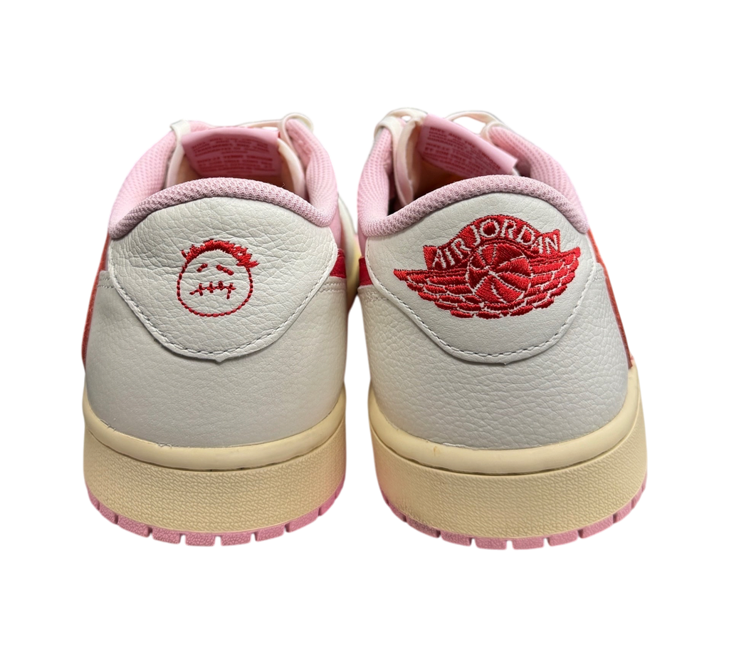 Genesis Boutique Jordan 1 Low Travis Scott Tropical Pink sneakers showing heel embroidery and cream midsole