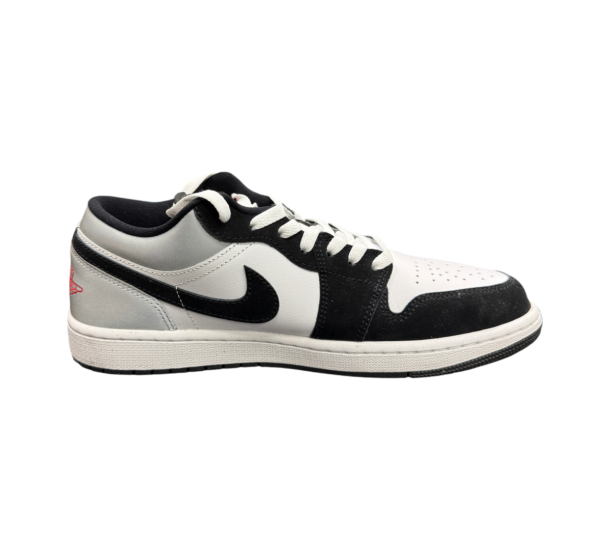 Genesis Boutique Jordan 1 Low sneaker in white, fire red, black, and matte silver with iconic swoosh branding.