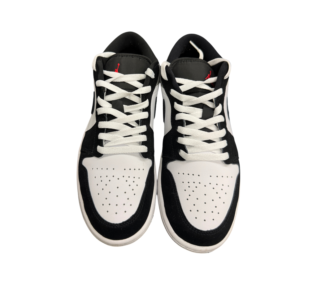 Genesis Boutique Jordan 1 Low sneakers in white, black, and fire red with perforated toe box and lace-up closure.