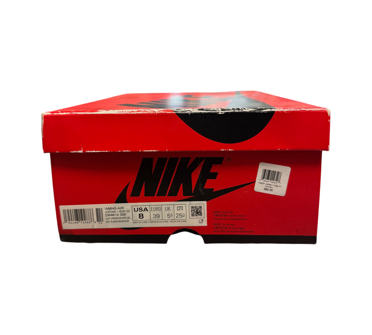 Genesis Boutique Jordan 1 High Lucky Green shoe box with red and black Nike branding on a glass display counter