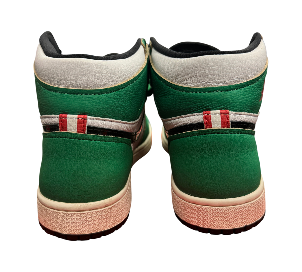 Genesis Boutique Jordan 1 High Lucky Green sneakers showing the green and white leather heel detail