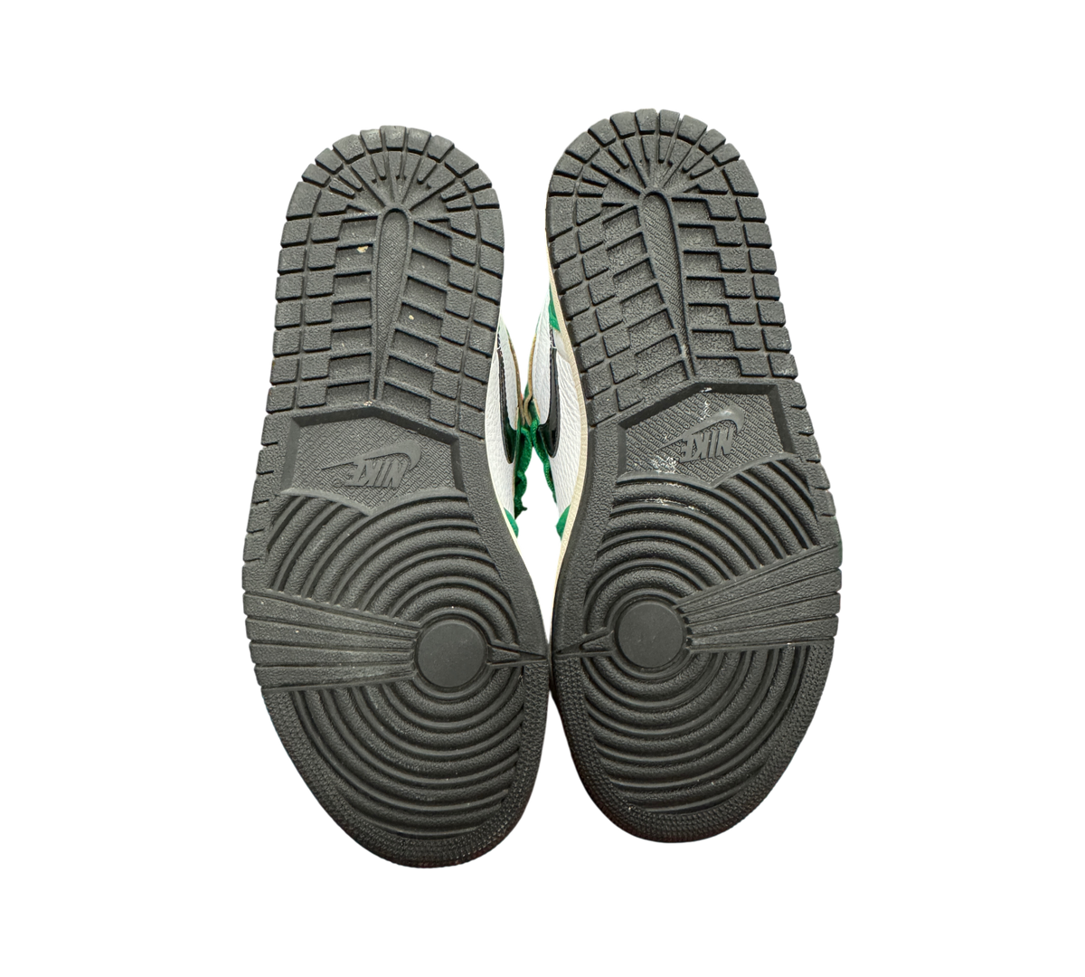 Genesis Boutique used Jordan 1 High Lucky Green sneakers showing black rubber outsoles with circular traction pattern