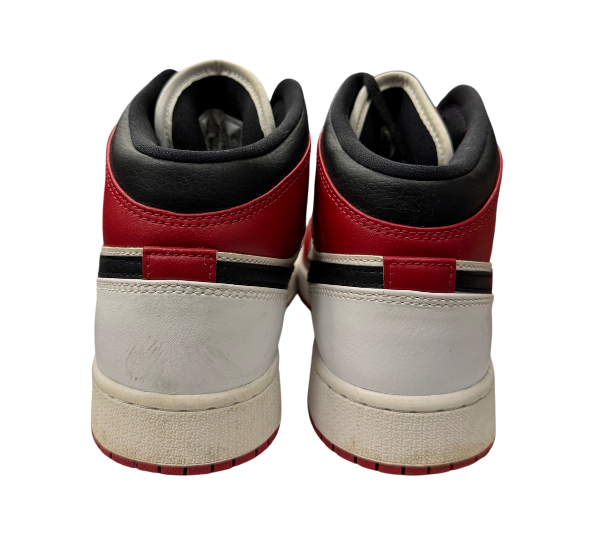 Genesis Boutique Jordan 1 Mid GS Chicago sneakers showing the red, white, and black leather heel view