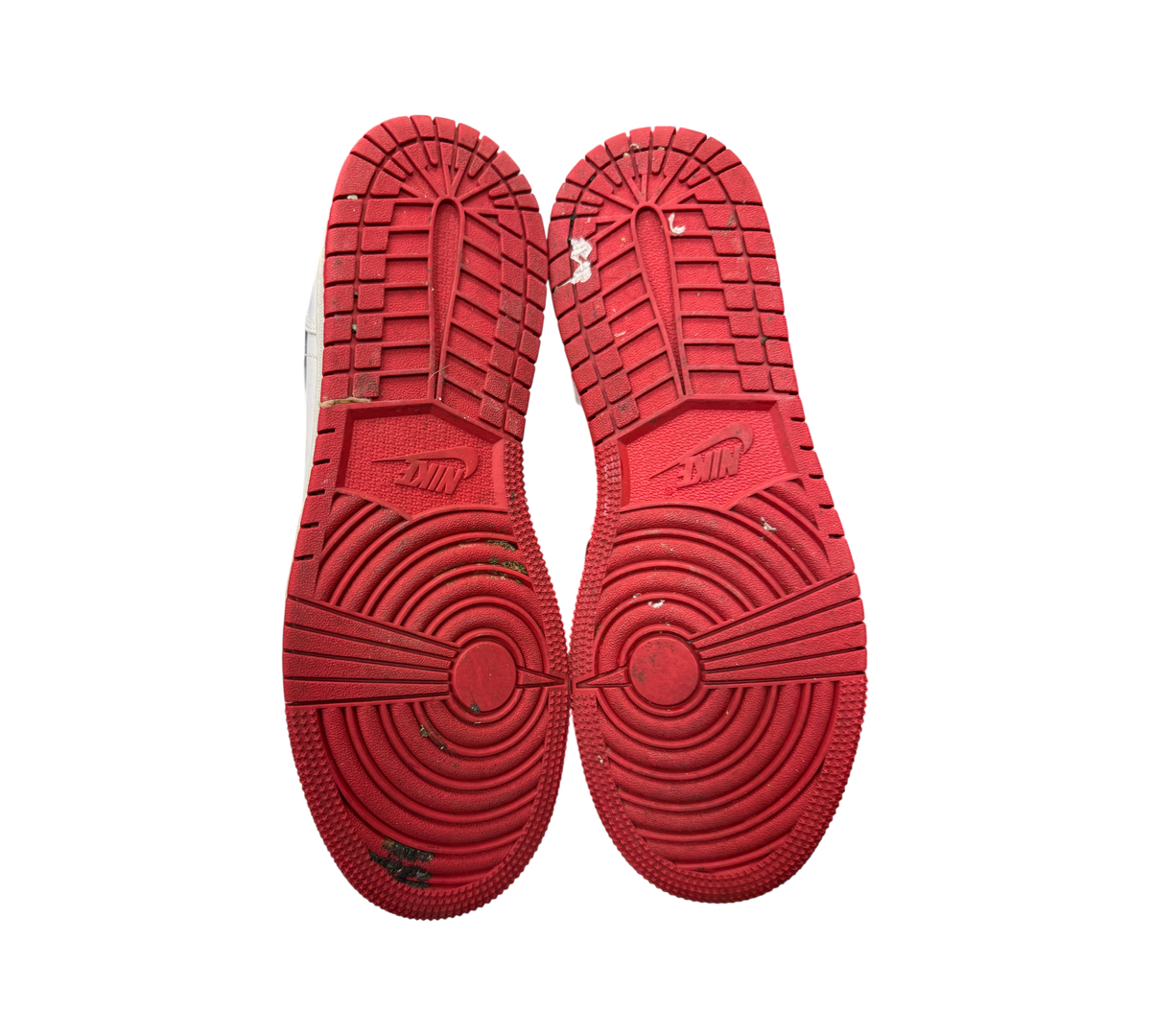 Genesis Boutique used Jordan 1 Mid GS Chicago sneakers showing red rubber outsoles with circular traction patterns