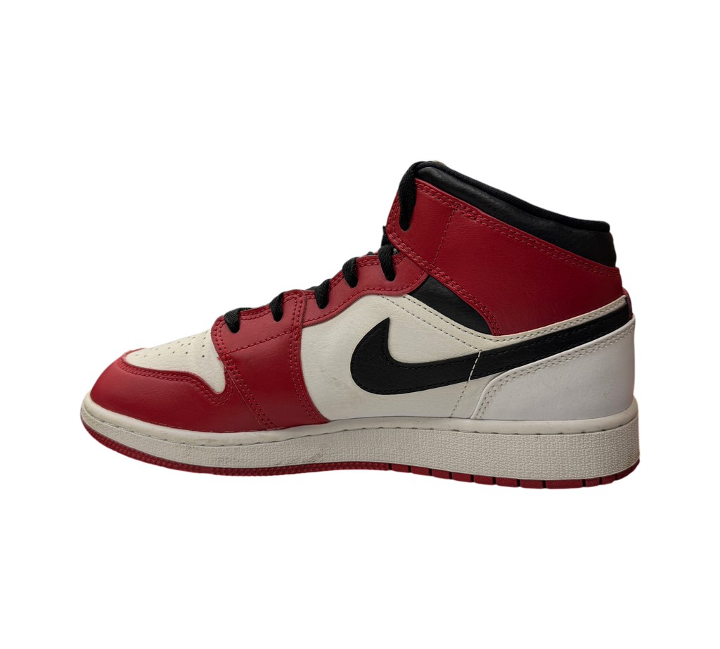 Genesis Boutique Jordan 1 Mid GS Chicago sneakers in red, white, and black leather, shown from a side profile view.