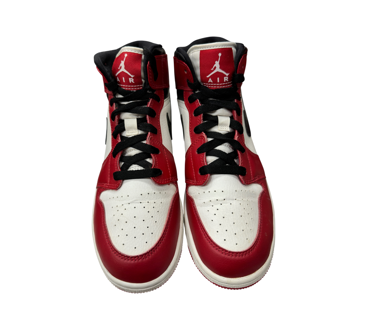 Genesis Boutique Jordan 1 Mid GS Chicago sneakers in white, red, and black leather with black laces and Jumpman logo.